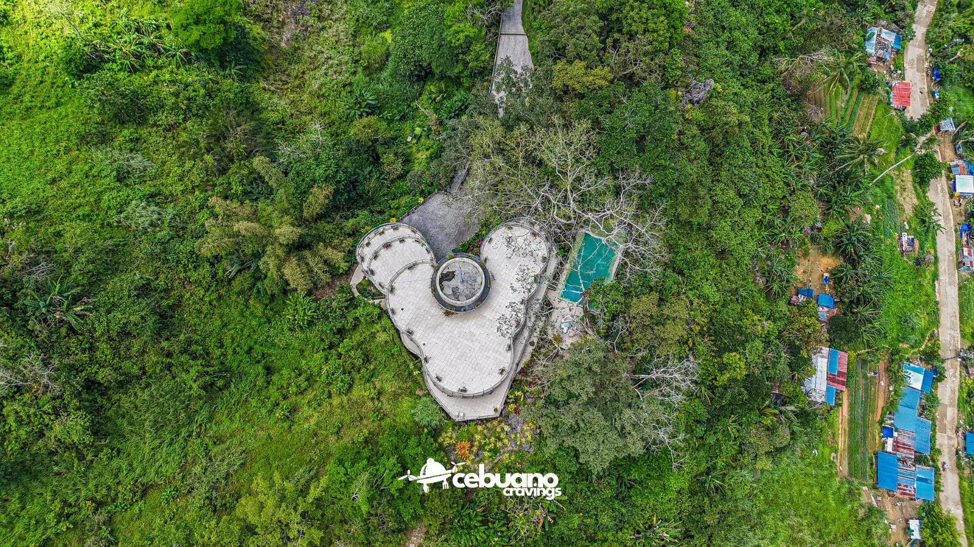 Top-down aerial view showing the Soul Sierra mansion footprint, terraces and pool within the forest